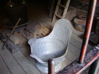 picture of old metal crapper
